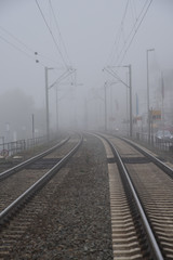 Fototapeta na wymiar A foggy station of railroad