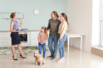 Real estate agent showing young family a new house