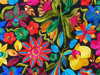Close up of сolorful embroidered decorative textile from Otavalo city at the artisans market
