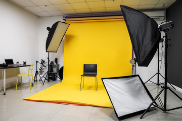 Chair and equipment in modern photo studio