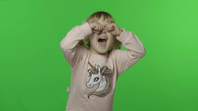 Girl in unicorn sweatshirt make faces and crying. Happy child. Chroma Key