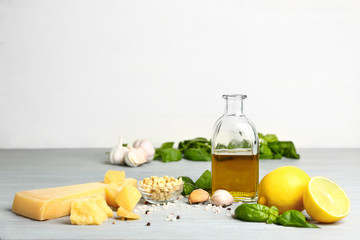 Ingredients for pesto sauce on grey table