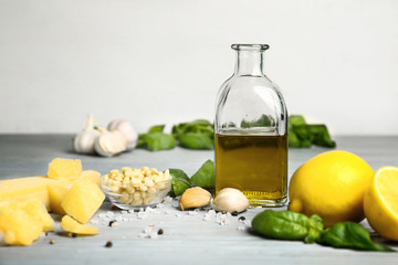 Ingredients for pesto sauce on grey table
