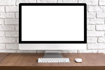 Mock up blank screen computer desktop with keyboard and mouse on wooden table