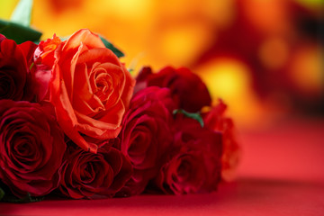 Fototapeta premium Red roses on a red background, Love and romance. Holiday