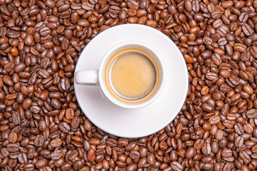 Neapolitan coffee. Cup of coffee on roasted coffee beans