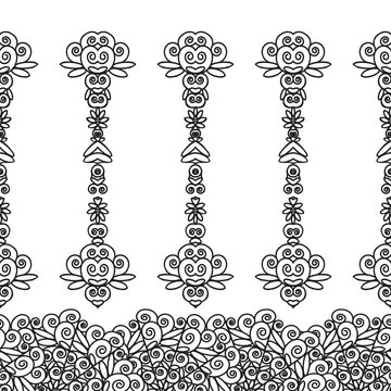 Pattern of black lace floral motifs on a white background