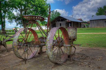 Fototapeta na wymiar Riding Cultivator, Pioneer Heritage Homestead Doniphan Missouri Built around 1900 