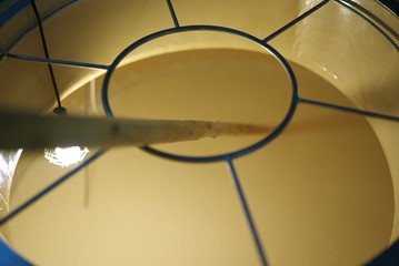 Tokyo,Japan-December 29, 2019: Mixing or stirring of fermentation mash of sake or seishu with a rod in a tank