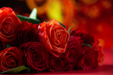 Red roses on a bright background, a holiday and a gift to women and girls. Valentine's day