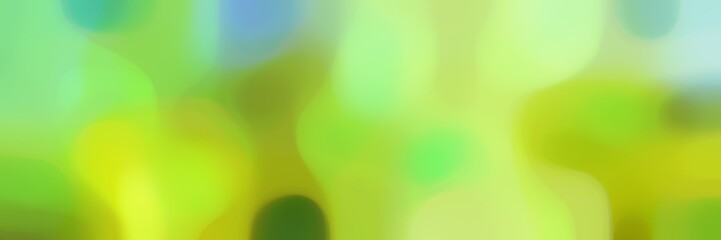 unfocused horizontal background graphic with yellow green, pastel blue and light green colors and space for text or image
