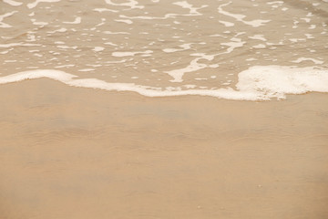 Golden sandy beach. Golden sandy beach with calm waves.