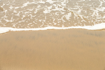 Fototapeta na wymiar Golden sandy beach. Golden sandy beach with calm waves.
