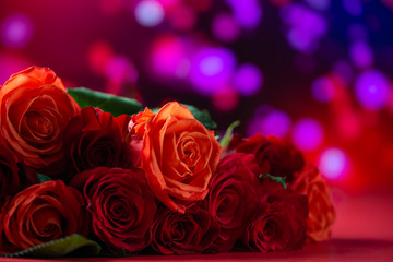 Abstract background and texture for Happy Valentine's Day greeting. Love and romantic bouquet of roses on a background of lights.