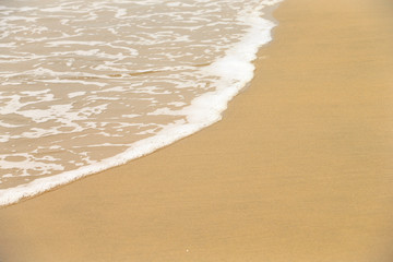 Golden sandy beach. Golden sandy beach with calm waves.