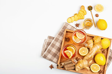 Ginger tea with lemon and honey on white background. Flat lay, top view, mock up, template, copy space, overhead