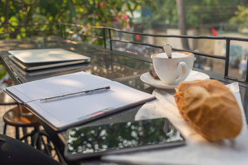 Nice working day with a cup of coffee and bread