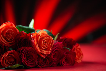 Bouquet of red roses, congratulations on Valentine's Day or mother's day, or March 8. Red background