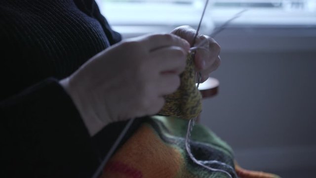 Lonely Senior woman, Grandmother Knitting at Home