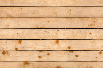 Obraz premium Natural wooden wall made of uncolored pine tree planks