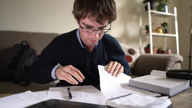 Crazy Hyperactive University Student On Caffeine Scribbling Notes While Studying For Exam