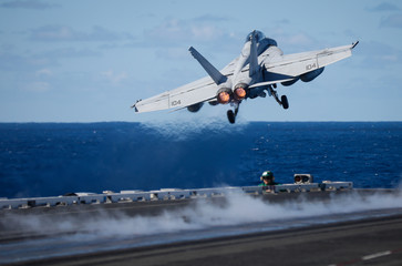 Naklejka na ściany i meble USS Ronald Reagan operates off the coast of Rockhampton, Australia during Exercise Talisman Sabre. A F/A-18 Super Hornet is catapulted off the deck