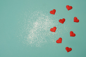 Red hearts on mint background. Valentine's day.