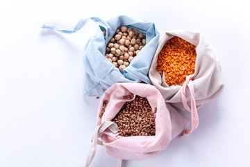 Reusable eco friendly natural cotton produce bags with cereal. Waste packaging. Zero waste food shopping. Plastic free items. Reuse, reduce, recycle, refuse
