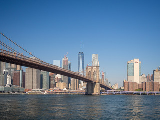 Fototapeta na wymiar Brooklyn bridge, New York, USA - September 2019: [ Brooklyn bridge architecture with panoramic view of New York City and lower Manhattan, One World Trade Center, Dumbo ]