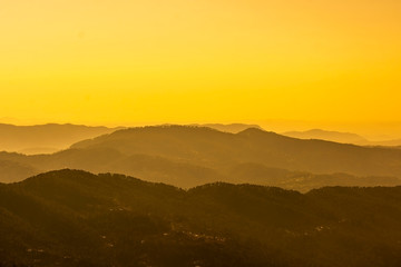 Sunset in the hazy mountains