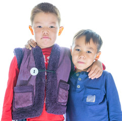 Portrait of two brothers in childhood against white background