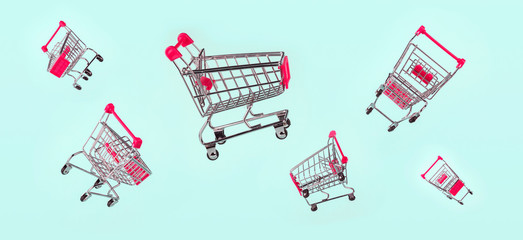 Set of flying metal grocery shopping basket, shopping car isolated on light blue background, banner. Concept of shopping, sales