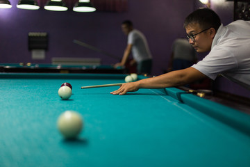 Playing billiard - Close-up shot of a man playing billiard