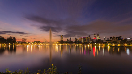 Fototapeta na wymiar Kuala Lumpur city waterfront skyline with reflections and beautiful morning sky
