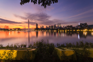 Fototapeta premium Kuala Lumpur city waterfront skyline with reflections and beautiful morning sky
