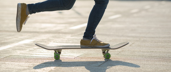 Skateboarder skateboarding at sunrise city