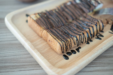 Sliced toasted bread topping with chocolate sauce