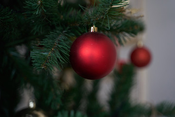 Christmas mood, Christmas tree, merry holidays. Christmas gift box, Blurred background, bokeh.