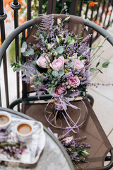 Wedding bouquet decorated with lavender flowers. A solemn event