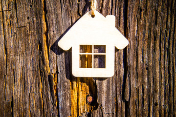 House symbol on a brown wooden background