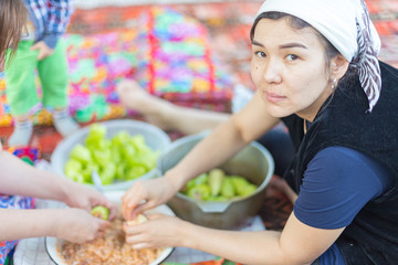 cooks girls, the process of cooking cabbage rolls from Bulgarian pepper