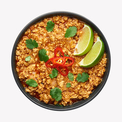 Chicken keema in black bowl isolated at white background. Kheema is indian and pakistani cuisine curry dish with minced meat and spices.