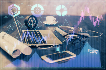 Financial graph colorful drawing and table with computer on background. Double exposure. Concept of international markets.