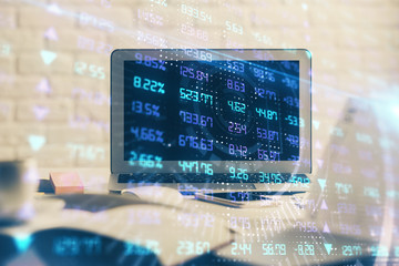 Financial market graph hologram and personal computer on background. Multi exposure. Concept of forex.