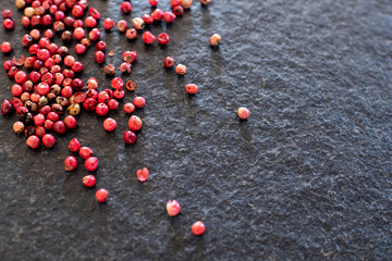 red pepper on black stone, gourmet spices and background for traditional Ionian or spicy cuisine. Background for kitchen and for pepper