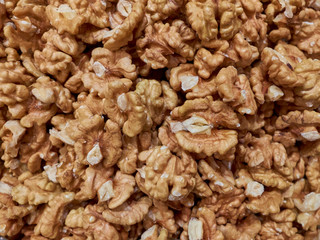 Raw walnut kernels background texture or concept