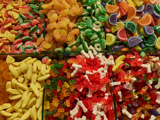 Jelly fruits and traditional turkish delight sweets at market counter
