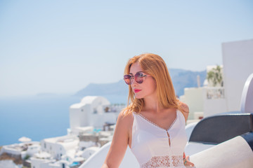 Fototapeta na wymiar Trip on a Santorini, vacation concept, pretty woman rest in Greece 