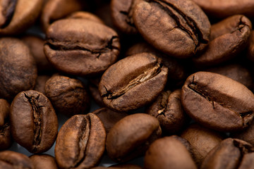 Coffee beans close-up background. Fresh roasted