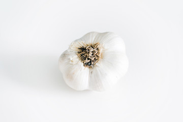 Beautiful composition of fresh garlic head on white background 